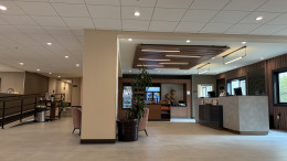 Hotel lobby and front desk in Clackamas, OR. Electrical and lighting for the full brand conversion, including linear and recessed LED, decorative fixtures and front-desk power.
